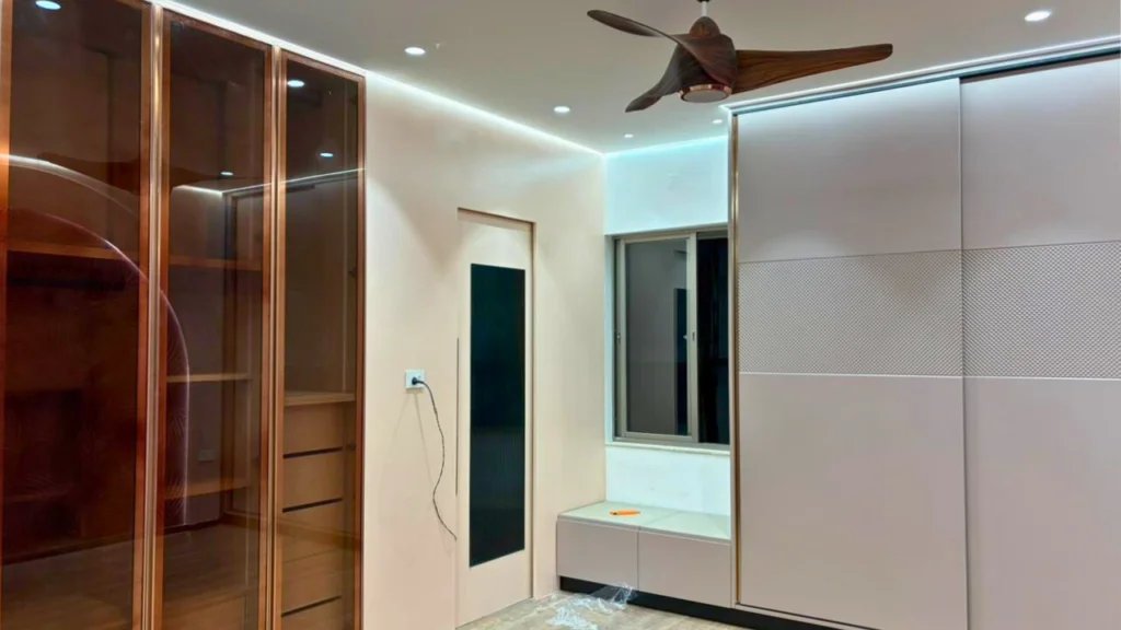 Kingston Park bedroom interior execution and warm finish coordination