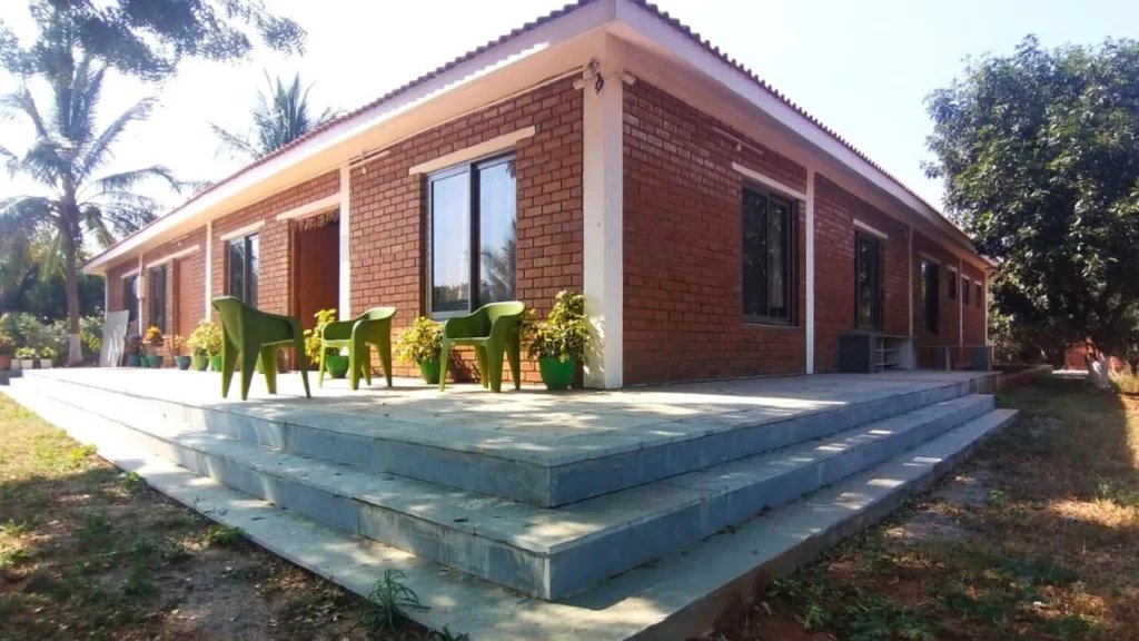 Prasanth Kumar Farmhouse exterior space and material coordination