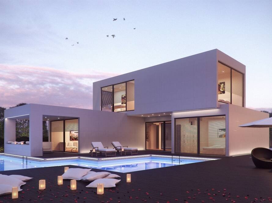Smart luxury home with pool and modern architecture at sunset