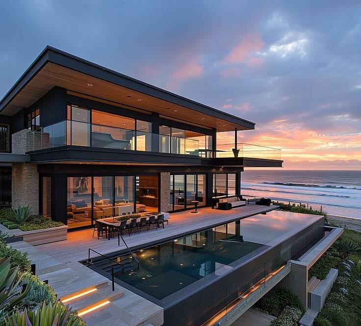 Modern coastal villa in North Goa with open balconies, large glass windows, and sea-facing outdoor spaces designed for humid coastal conditions