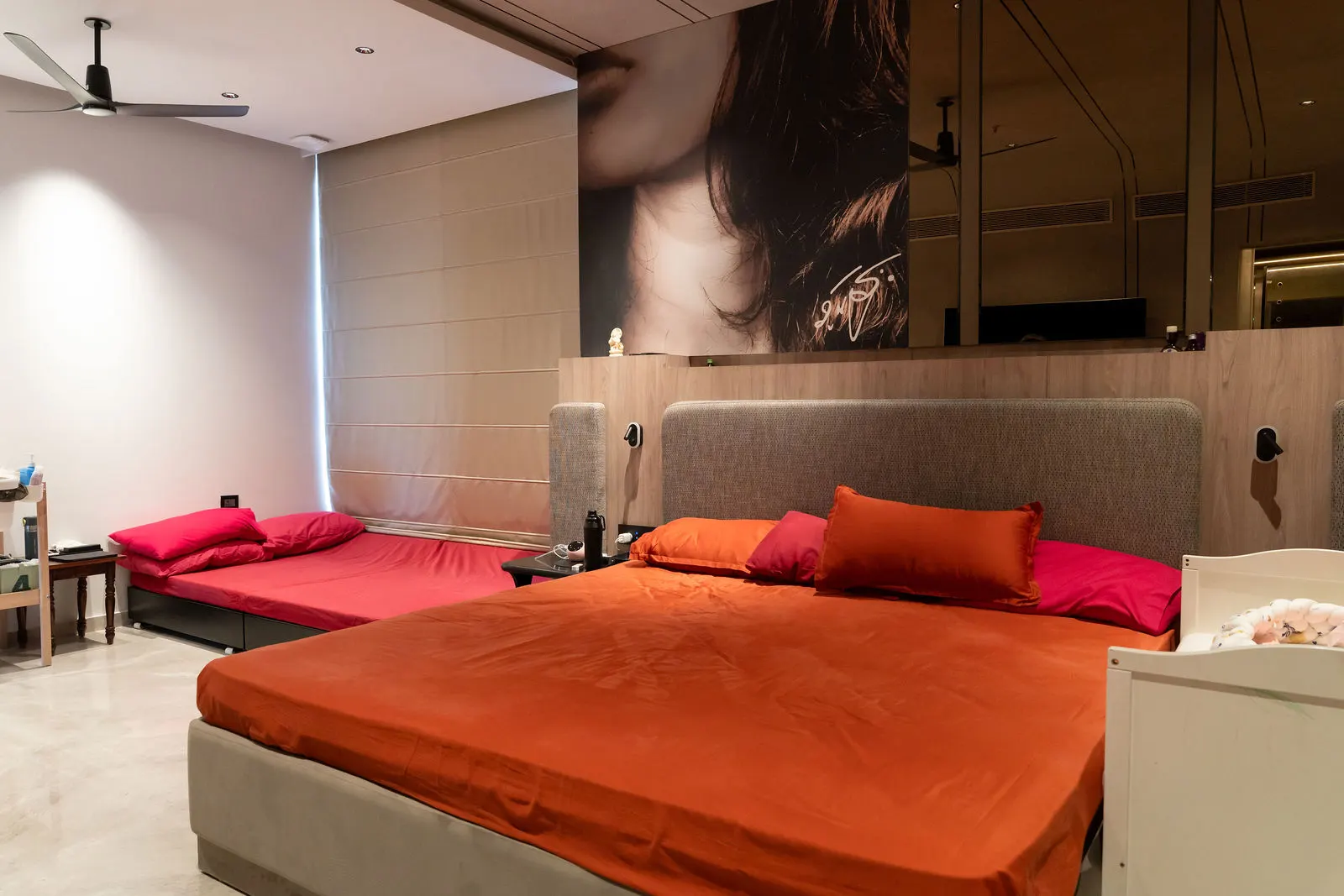 Wide view of the guest bedroom and its wardrobe wall