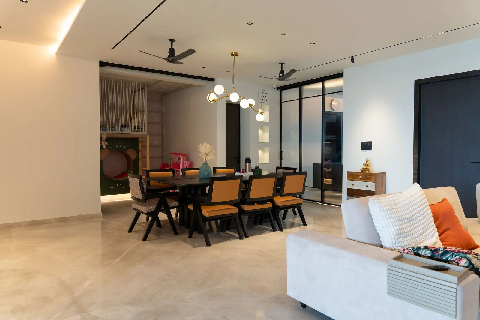 Dining area seen through a slim glass partition