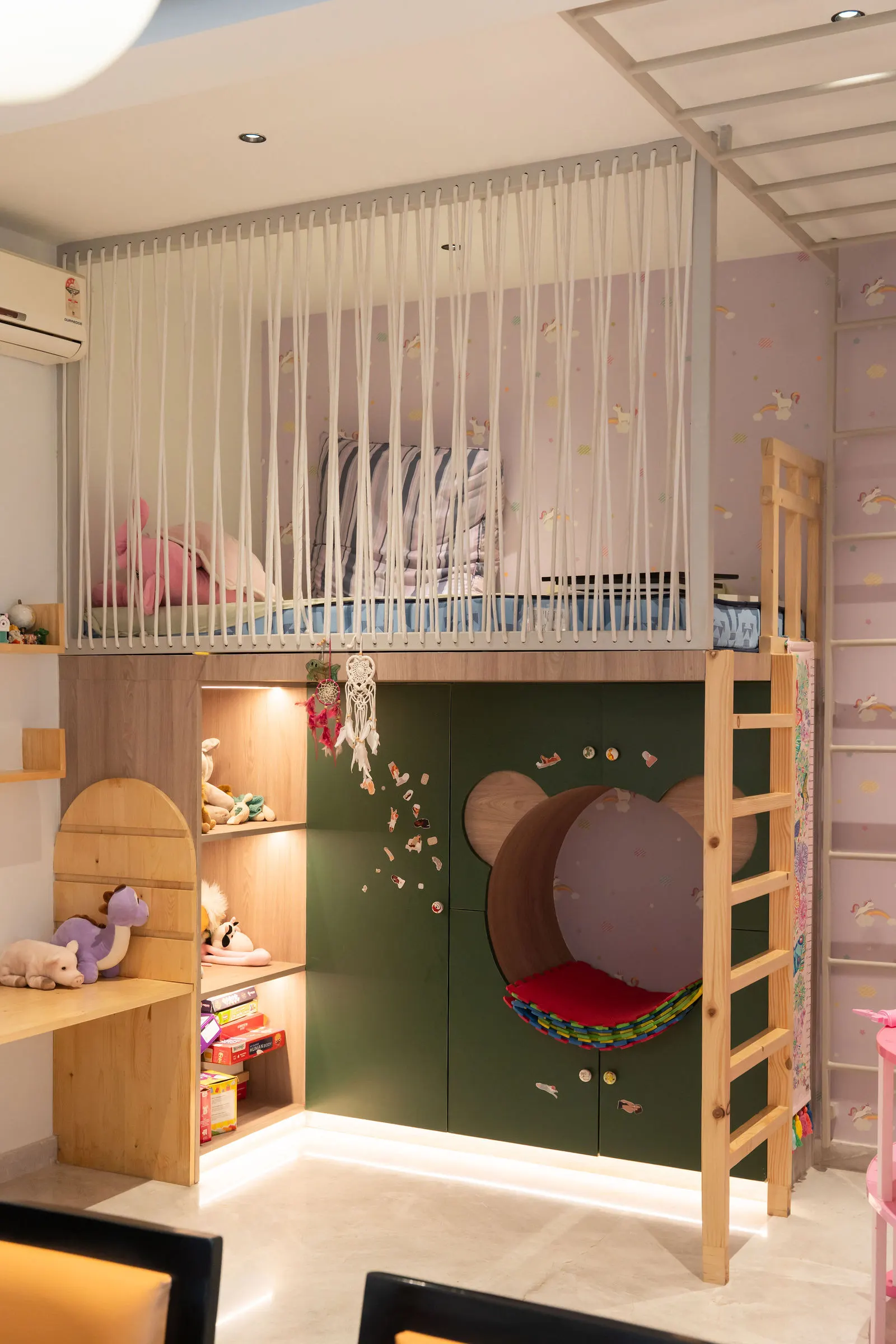 Kids room play zone with a padded green wall