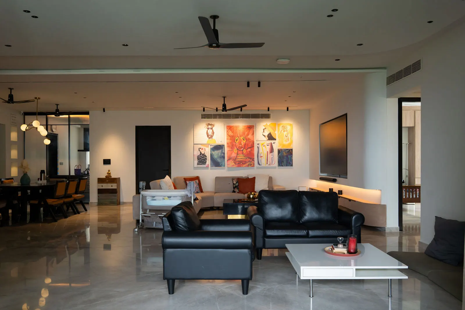 Blue sofa and warm wood panelling in the living room