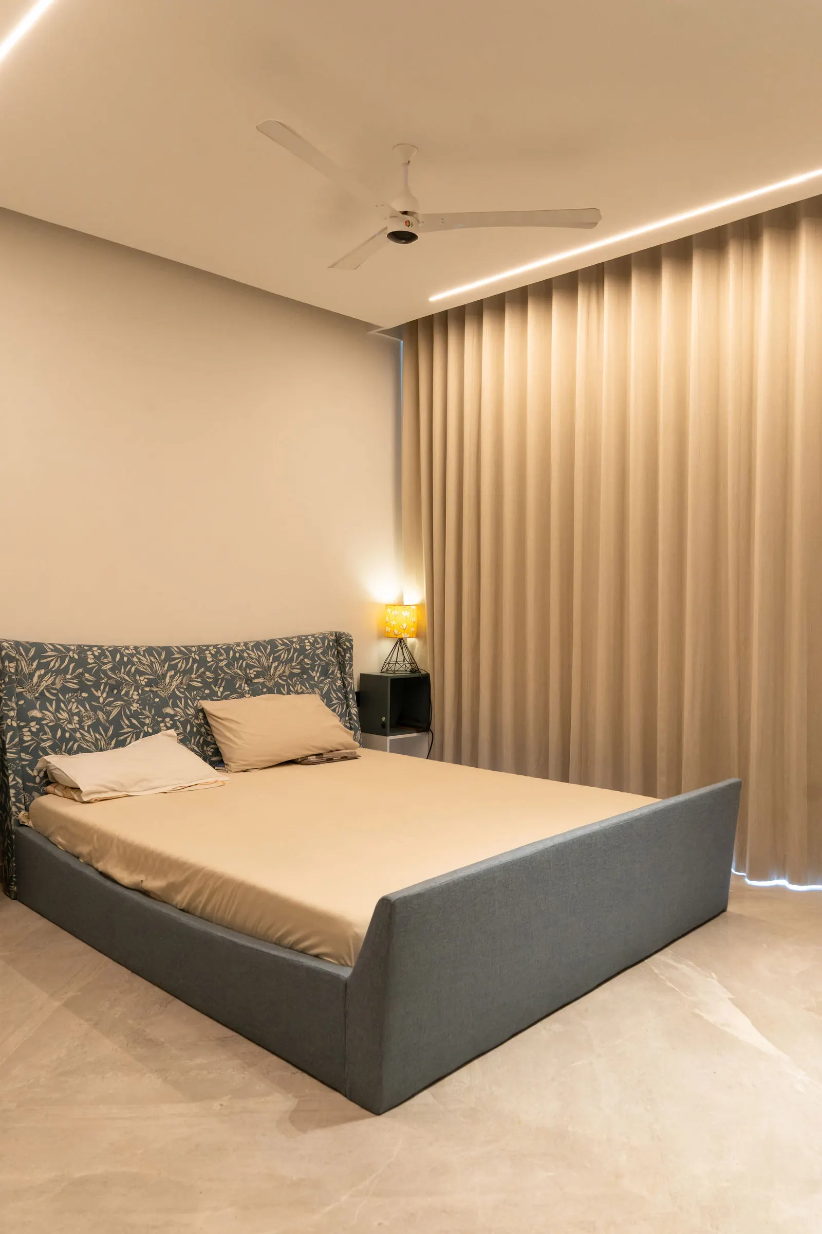 Bedhead detail against full-height fluted panelling