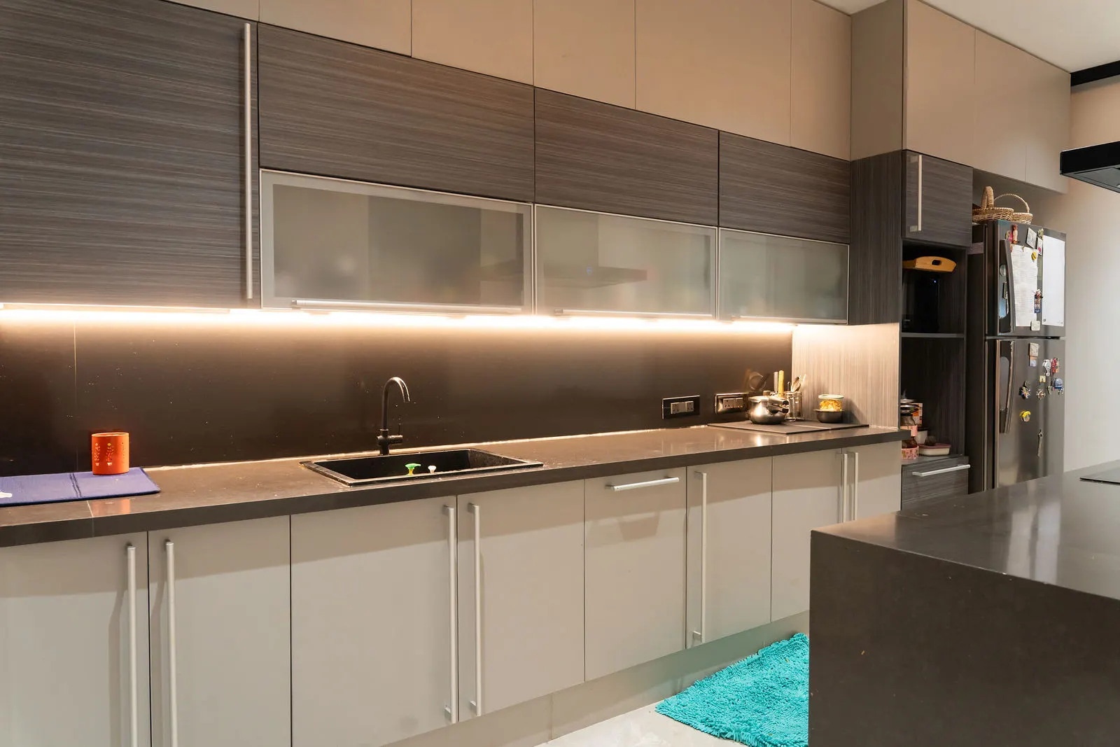 Kitchen counter run with tall units and a built-in oven