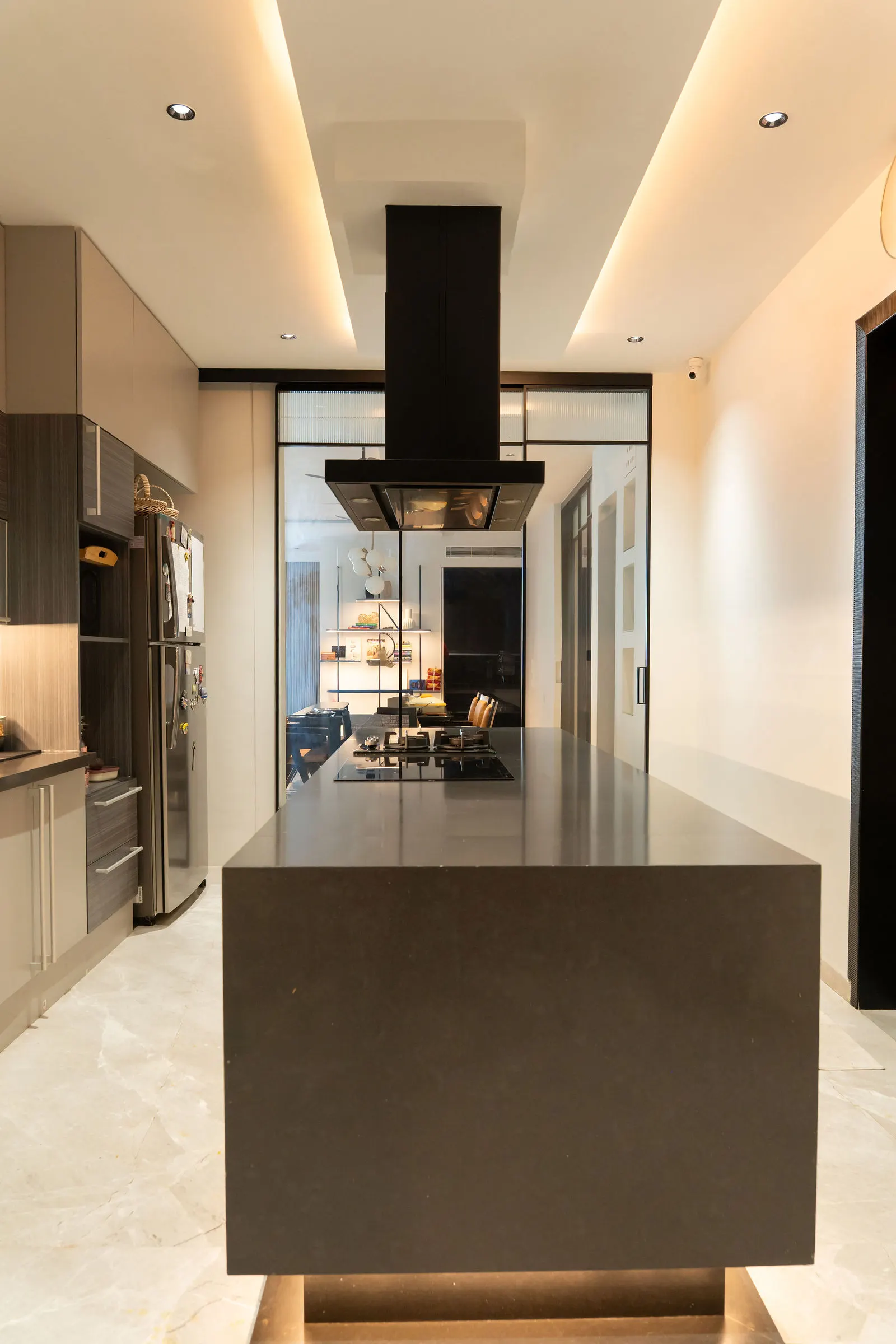Kitchen island and tall unit wall seen end on