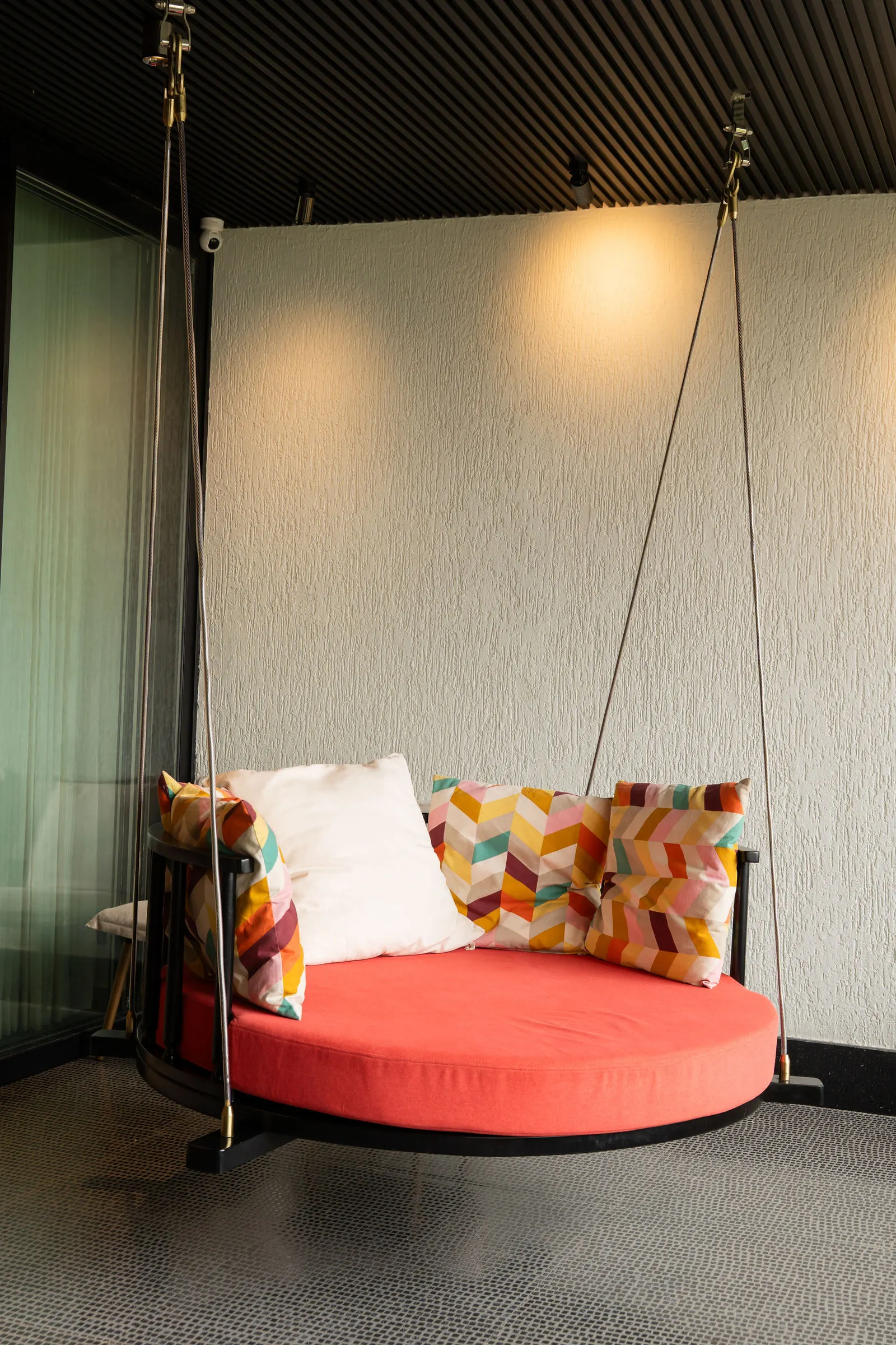 Round daybed set into a curtained corner
