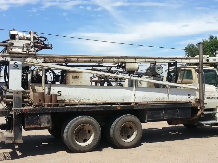 A water well drilling rig set up on site