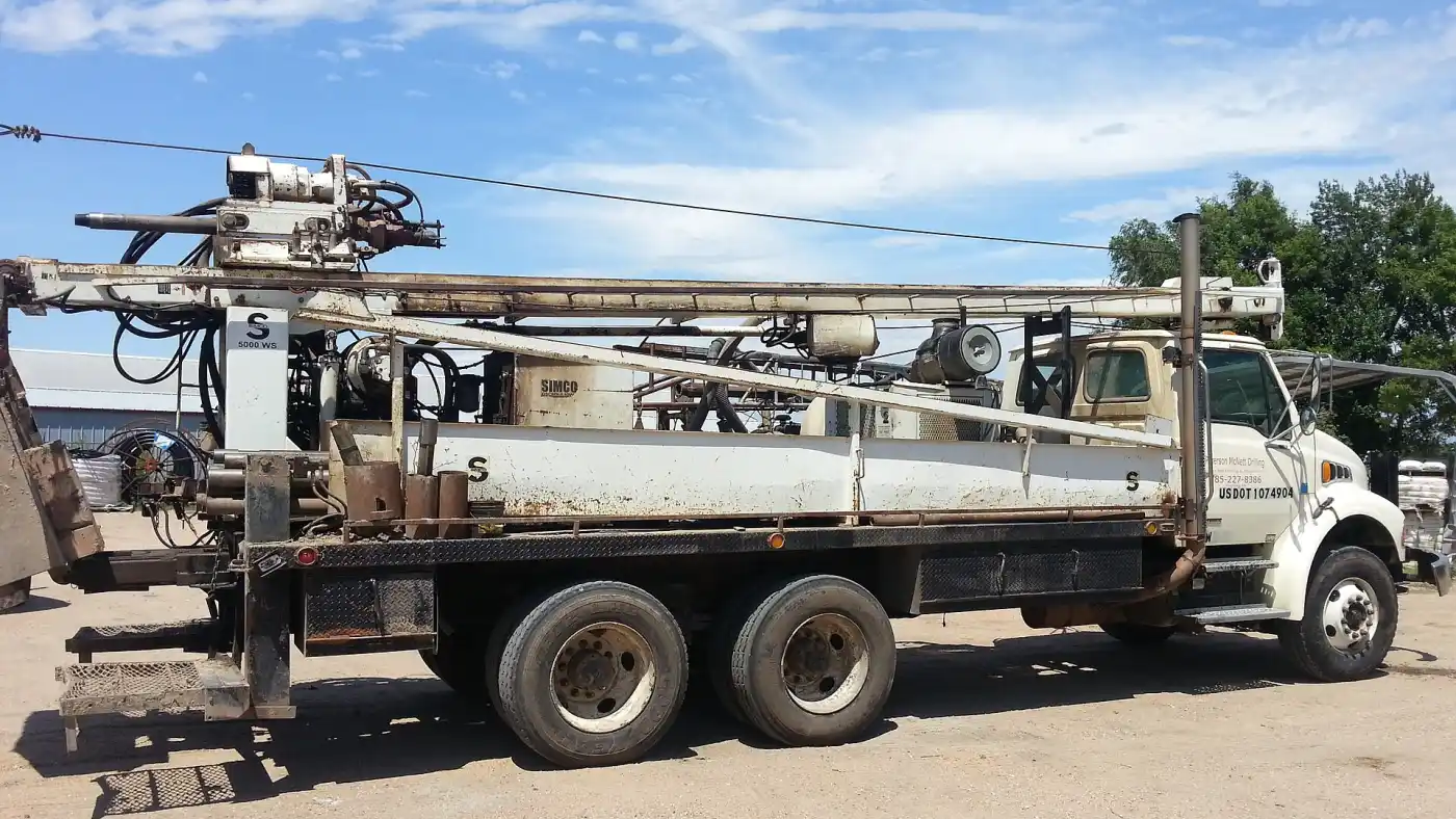 A water well drilling rig set up on site