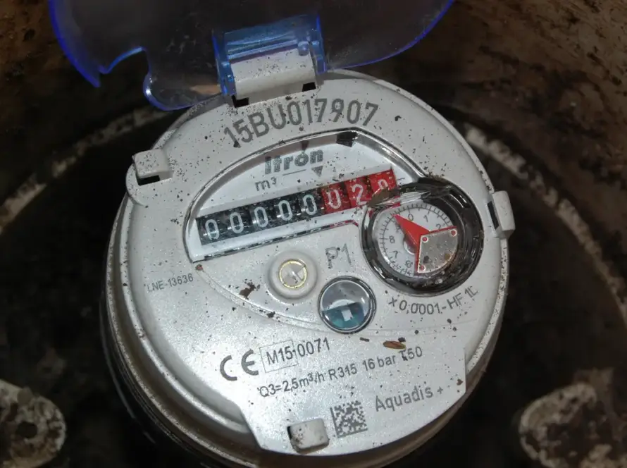 A domestic water meter installed in a chamber