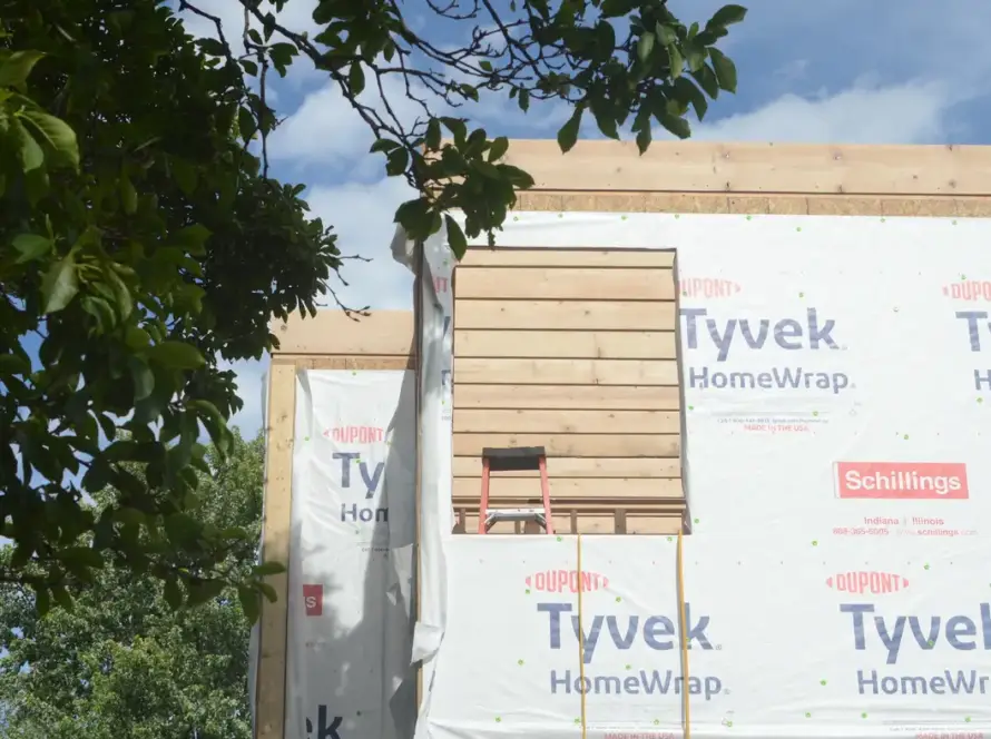 A house under construction on its plot