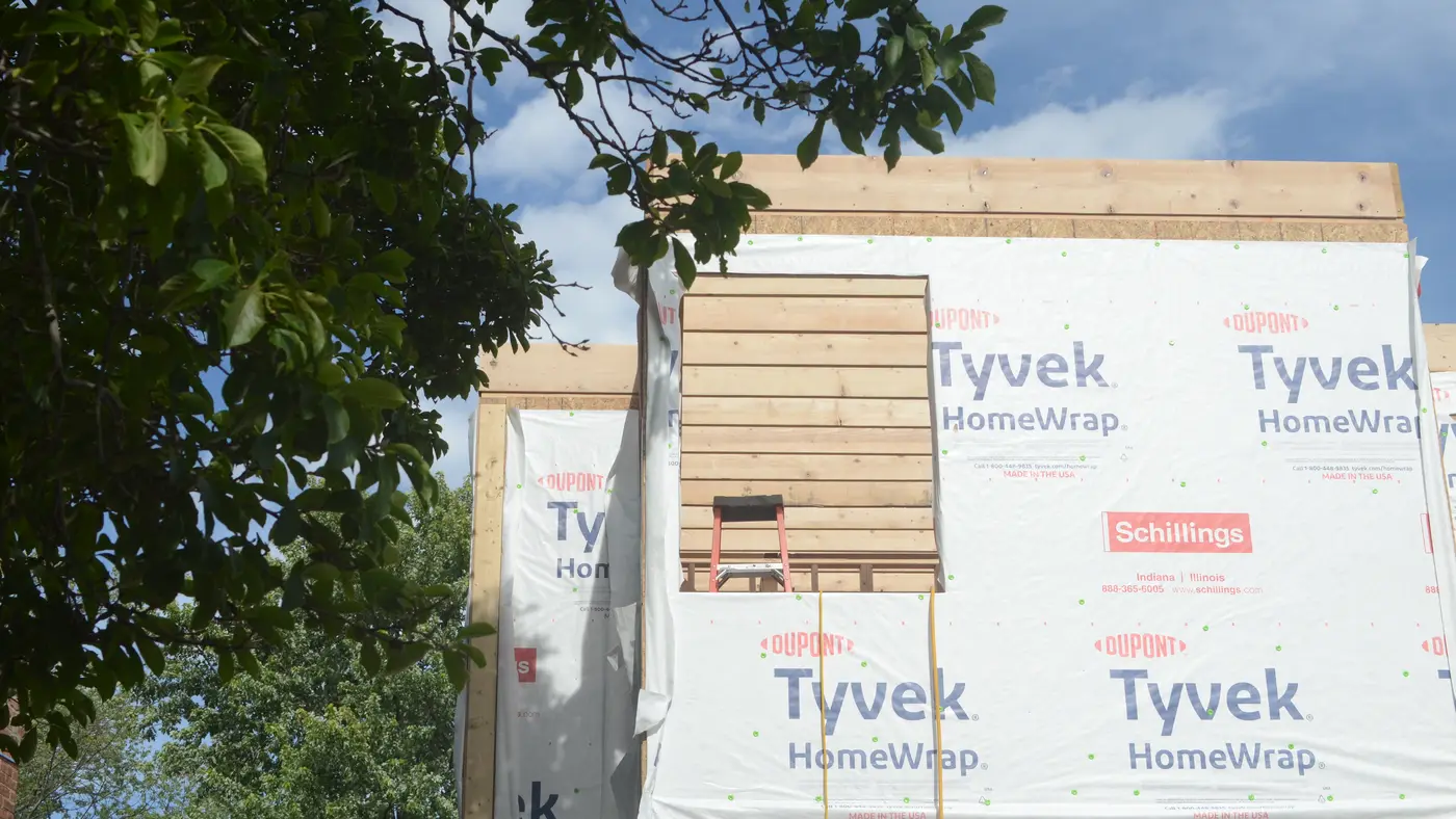 A house under construction on its plot